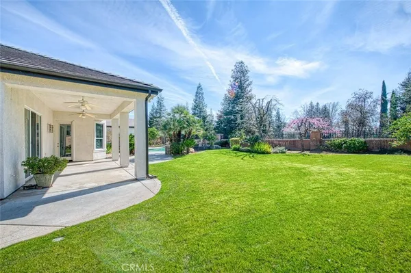 a view of a house with a garden and pathway