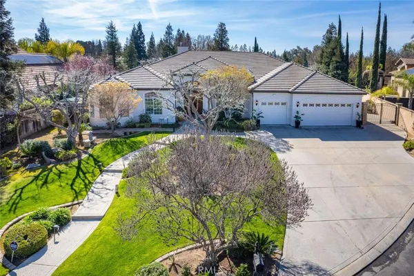 a aerial view of a house with a yard