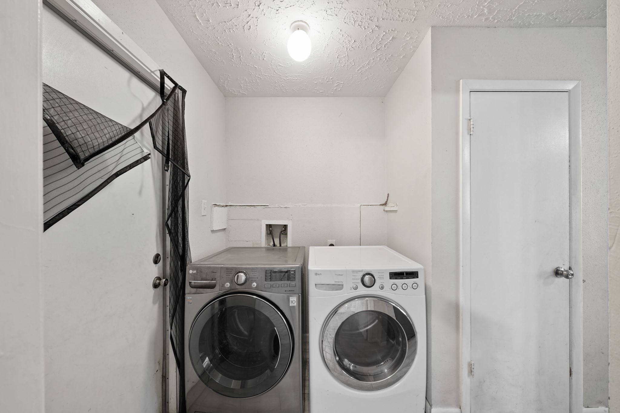 13923 Ludgate Pass Houston, TX 77034 - Photo 13 of 25 a view of a hallway with washer and dryer