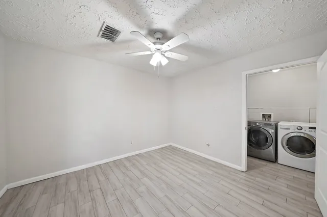 a view of a storage & utility room with wooden floor