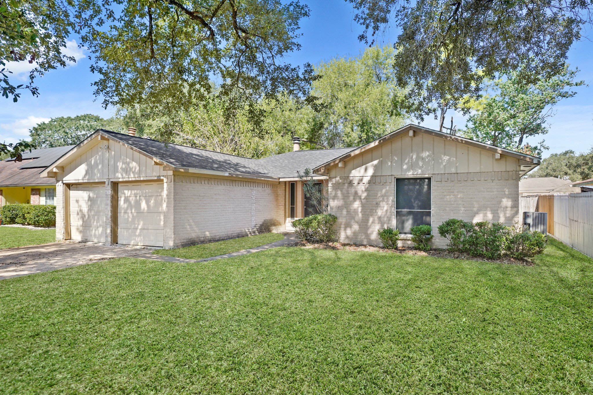 13923 Ludgate Pass Houston, TX 77034 - Photo 2 of 25 a front view of a house with a yard