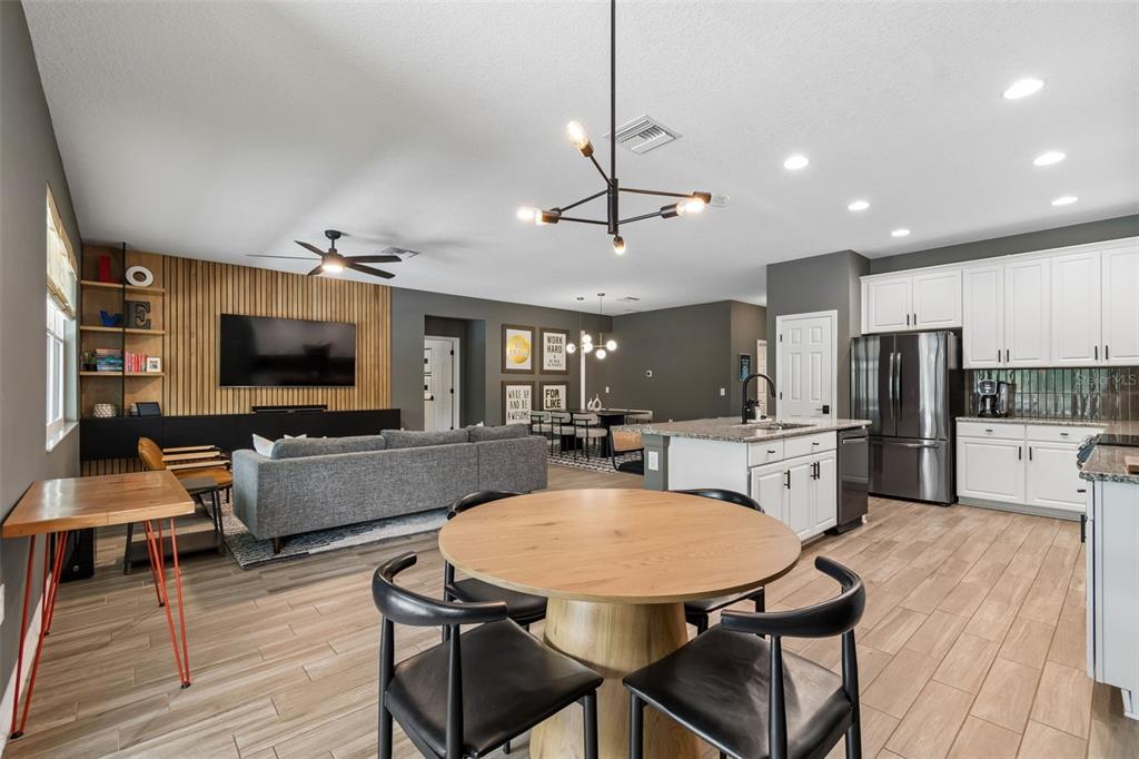 18078 Romanesque Court Spring Hill, FL 34610 - Photo 27 of 98 a view of a dining room with furniture wooden floor and chandelier