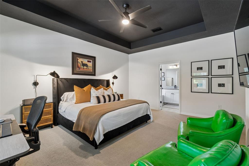 18078 Romanesque Court Spring Hill, FL 34610 - Photo 54 of 98 a bedroom with a bed and a couch