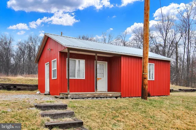 a view of a house with red door