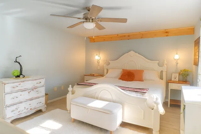 a bedroom with a bed and a cabinets