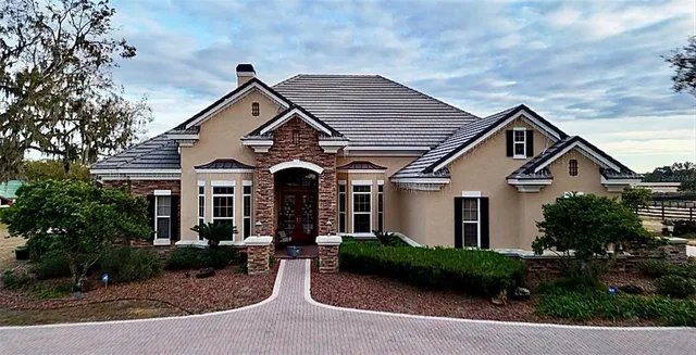 a front view of a house with garden
