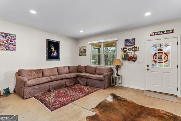 a bathroom with a granite countertop double vanity sink and a mirror