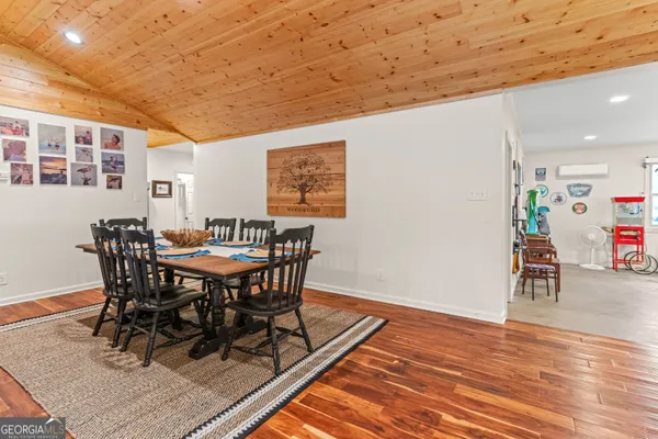a view of a hall with wooden floor
