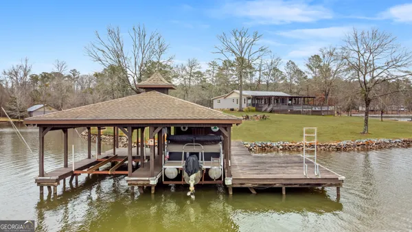 a view of a lake with a house next to a lake
