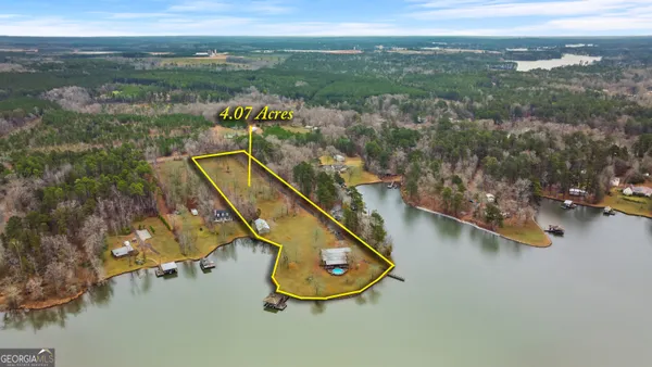 an aerial view of lake residential house with outdoor space