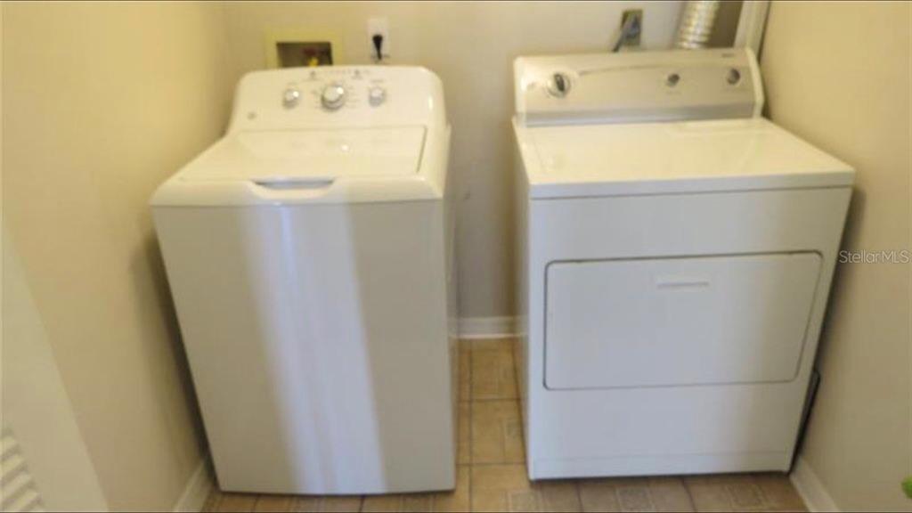 1083 South Hiawassee Road, Unit 635 Orlando, FL 32835 - Photo 12 of 16 a utility room with dryer and washer
