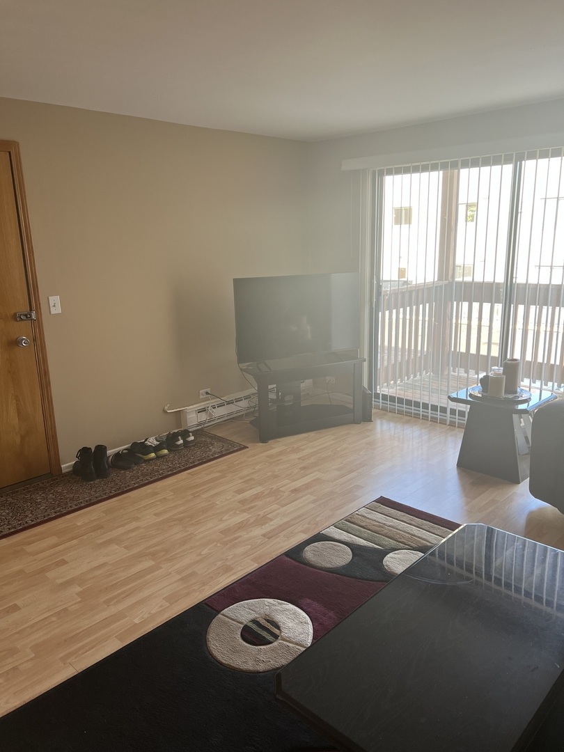 5117 North East River Road, Unit 2A Chicago, IL 60656 - Photo 11 of 32 a view of empty room with wooden floor