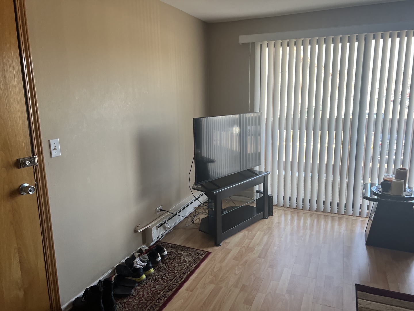 5117 North East River Road, Unit 2A Chicago, IL 60656 - Photo 14 of 32 a room with wooden floor and windows