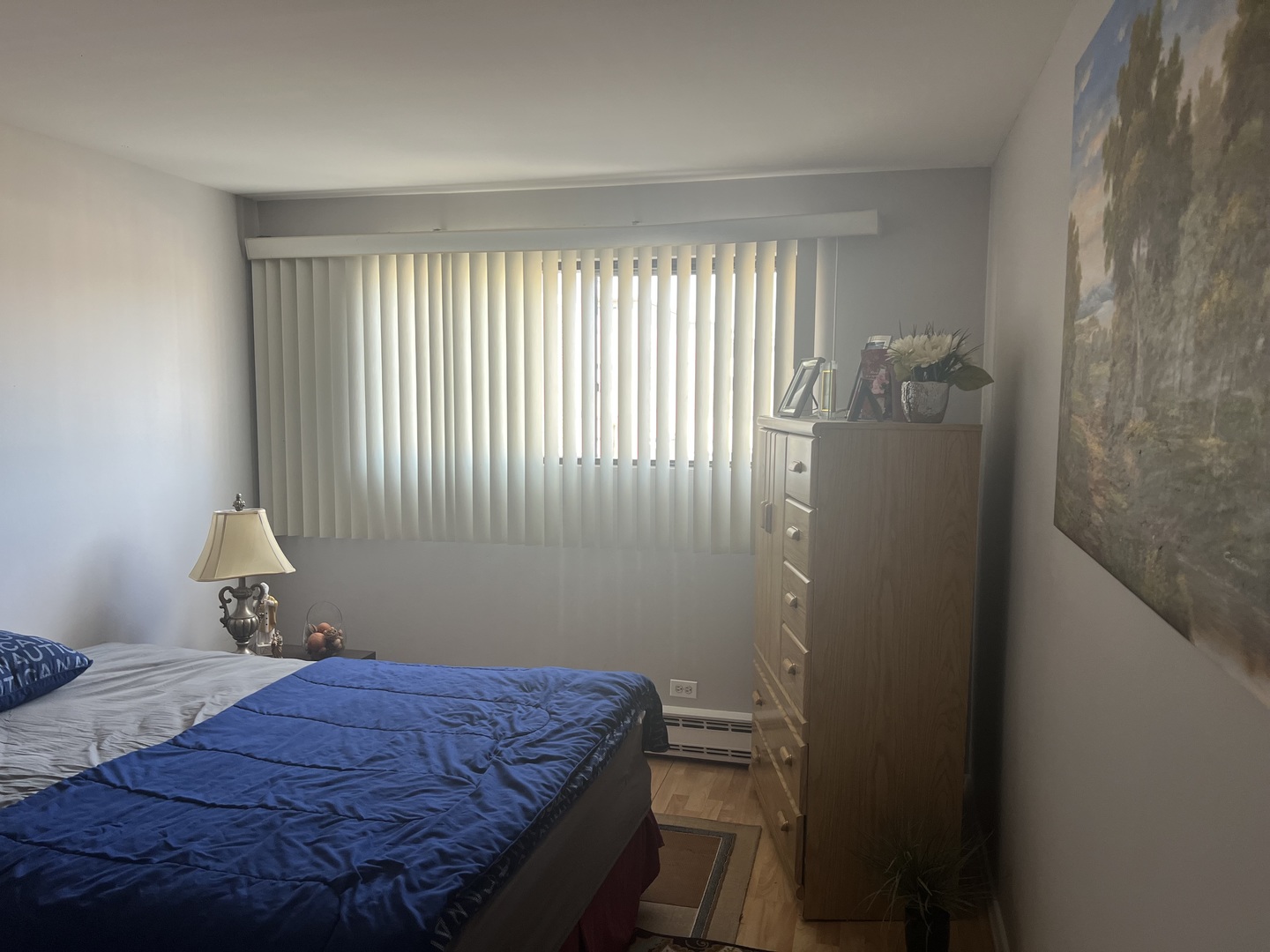 5117 North East River Road, Unit 2A Chicago, IL 60656 - Photo 16 of 32 a bedroom with a bed and a window