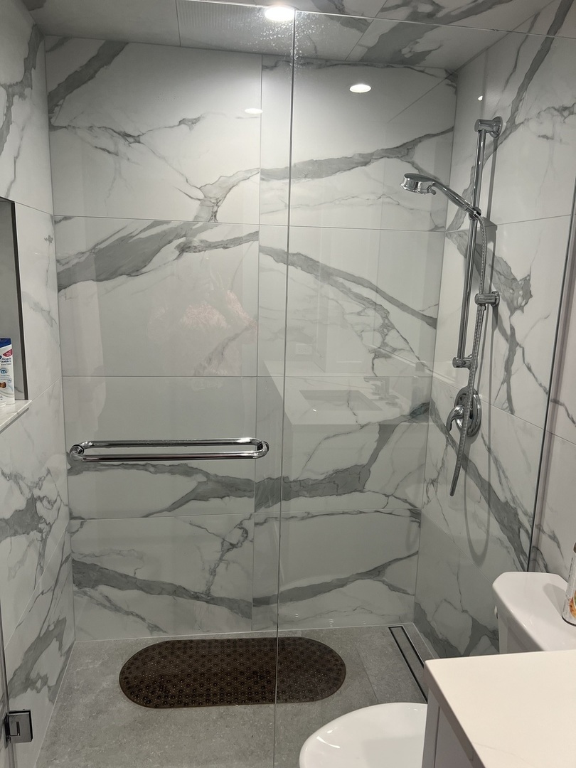 5117 North East River Road, Unit 2A Chicago, IL 60656 - Photo 22 of 32 a bathroom with a shower