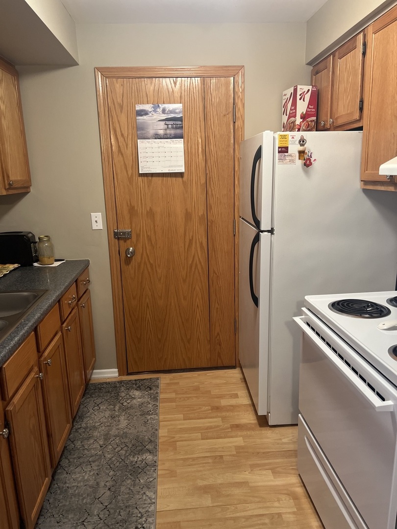 5117 North East River Road, Unit 2A Chicago, IL 60656 - Photo 23 of 32 a room with storage and utility