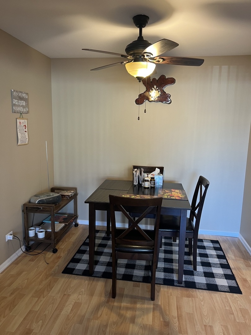 5117 North East River Road, Unit 2A Chicago, IL 60656 - Photo 26 of 32 a view of a dining room with furniture