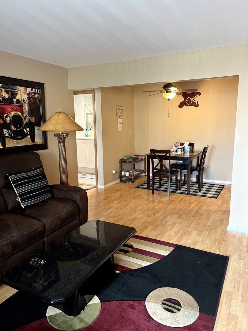 5117 North East River Road, Unit 2A Chicago, IL 60656 - Photo 9 of 32 a room with furniture and rug