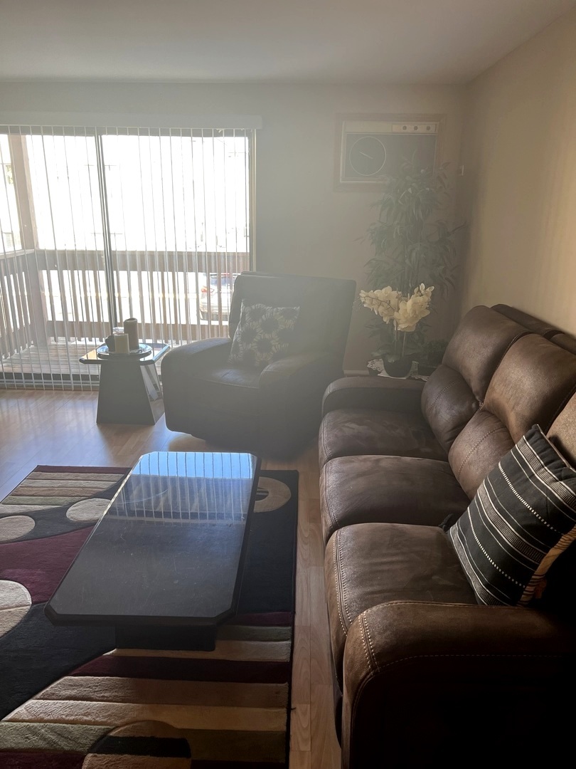 5117 North East River Road, Unit 2A Chicago, IL 60656 - Photo 10 of 32 a living room with furniture and a window