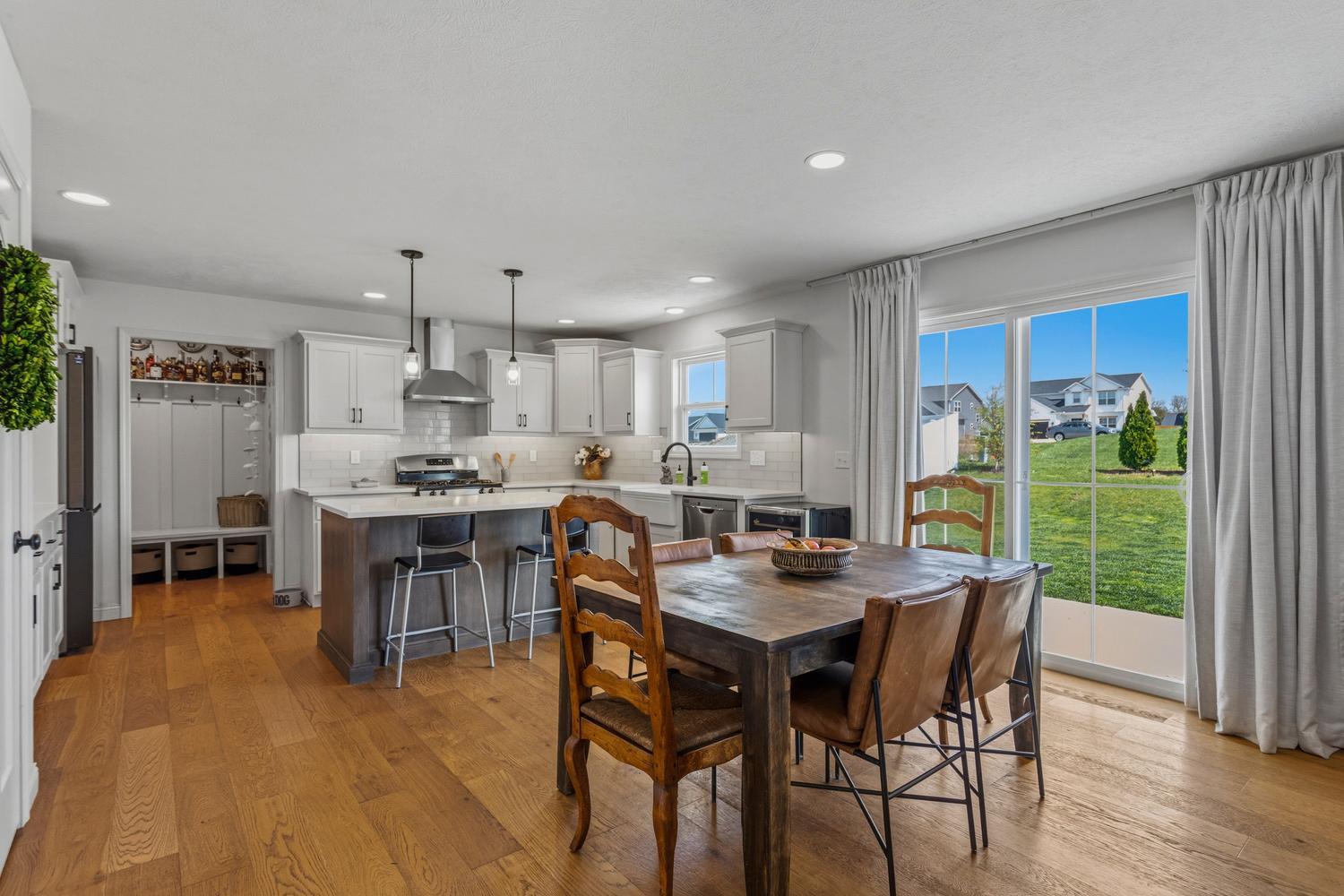 718 Cole Lane Mahomet, IL 61853 - Photo 11 of 44 a view of a dining room with furniture and wooden floor
