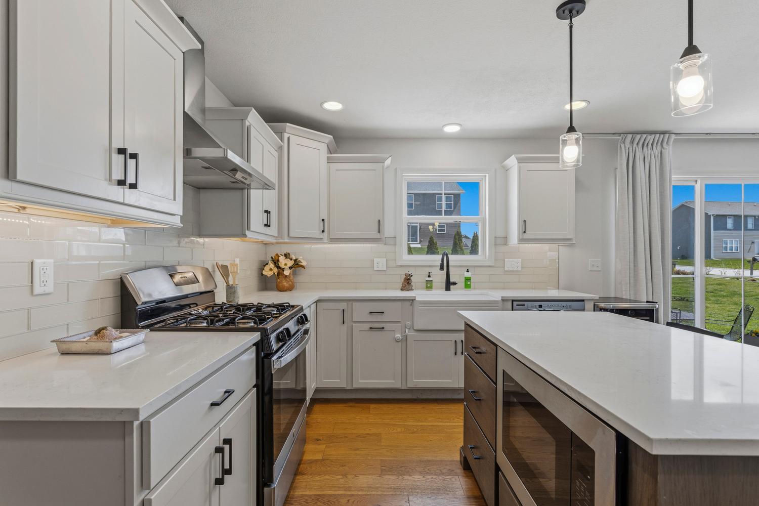 718 Cole Lane Mahomet, IL 61853 - Photo 13 of 44 a kitchen with a sink stove and cabinets