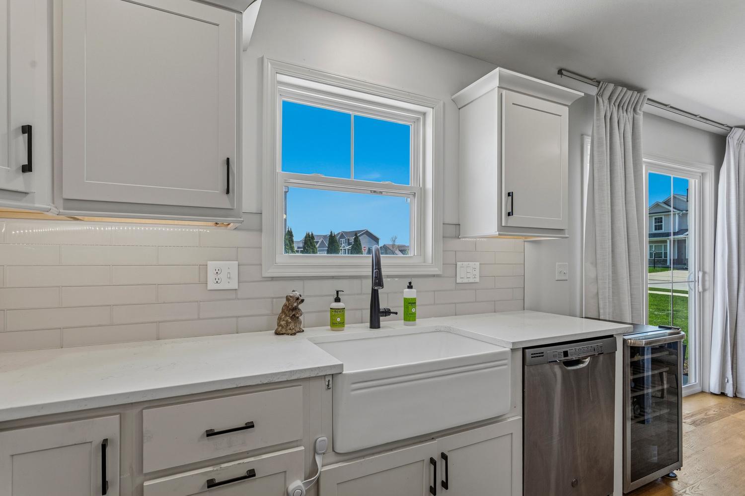 718 Cole Lane Mahomet, IL 61853 - Photo 16 of 44 a kitchen with a sink cabinets and window