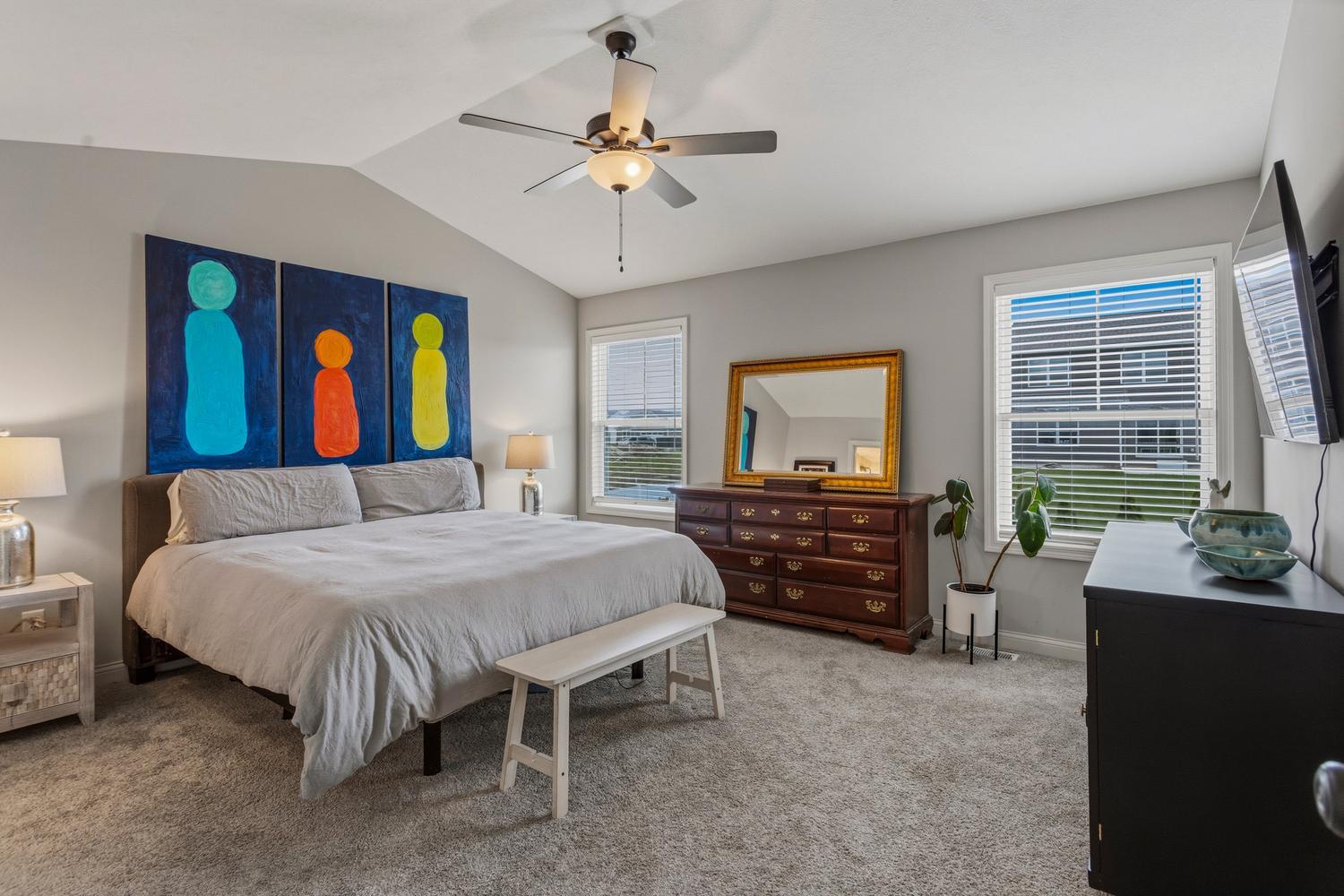 718 Cole Lane Mahomet, IL 61853 - Photo 20 of 44 a bedroom with a bed and a chandelier