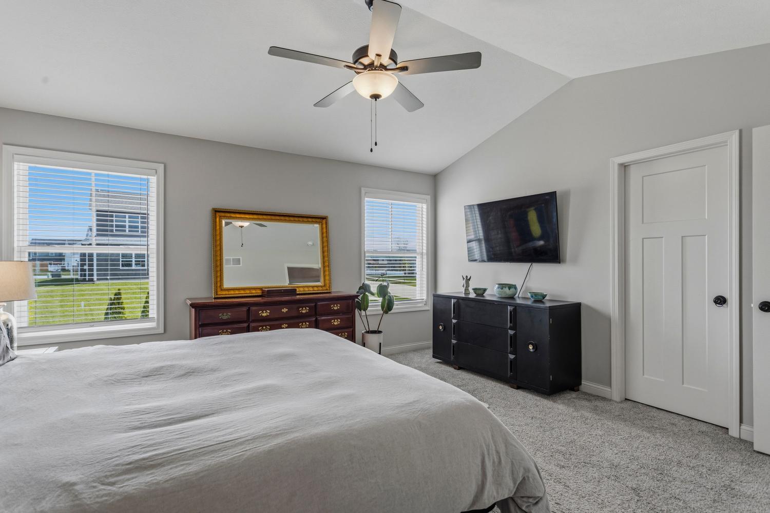 718 Cole Lane Mahomet, IL 61853 - Photo 21 of 44 a bedroom with a bed and a flat screen tv