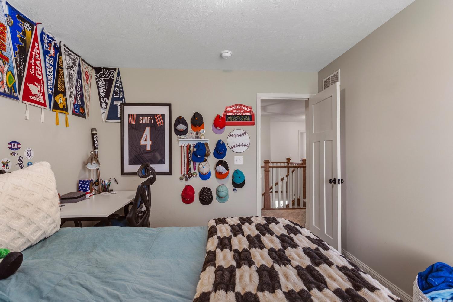 718 Cole Lane Mahomet, IL 61853 - Photo 26 of 44 a bedroom with furniture and baby bed