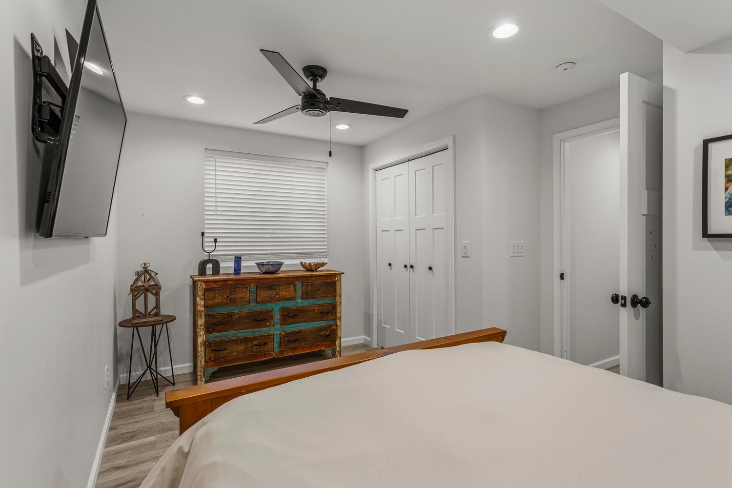 718 Cole Lane Mahomet, IL 61853 - Photo 36 of 44 a bedroom with a bed and a flat tv screen