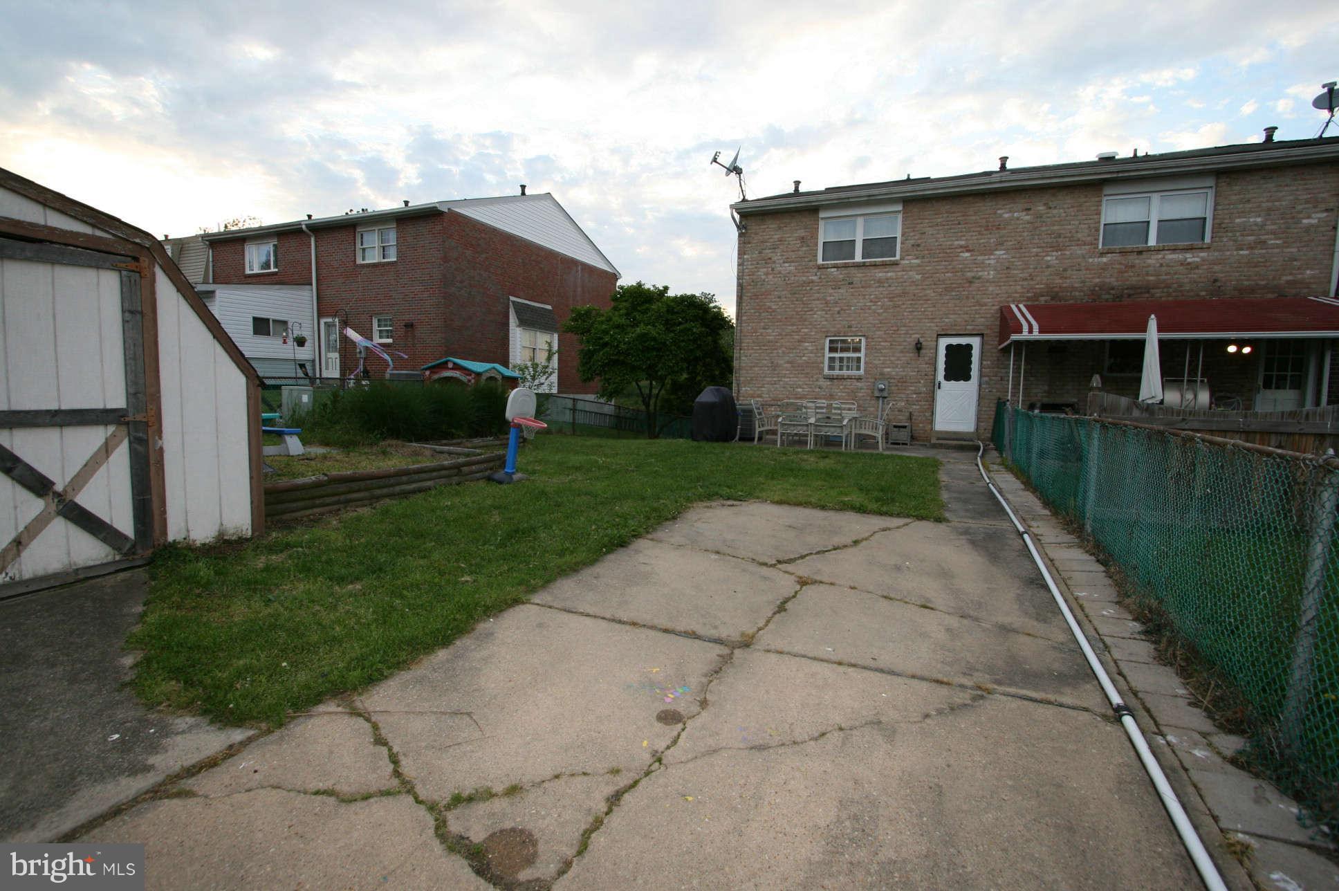 951 Elm Road Baltimore, MD 21227 - Photo 22 of 26 Parking pad and large shed i the rear