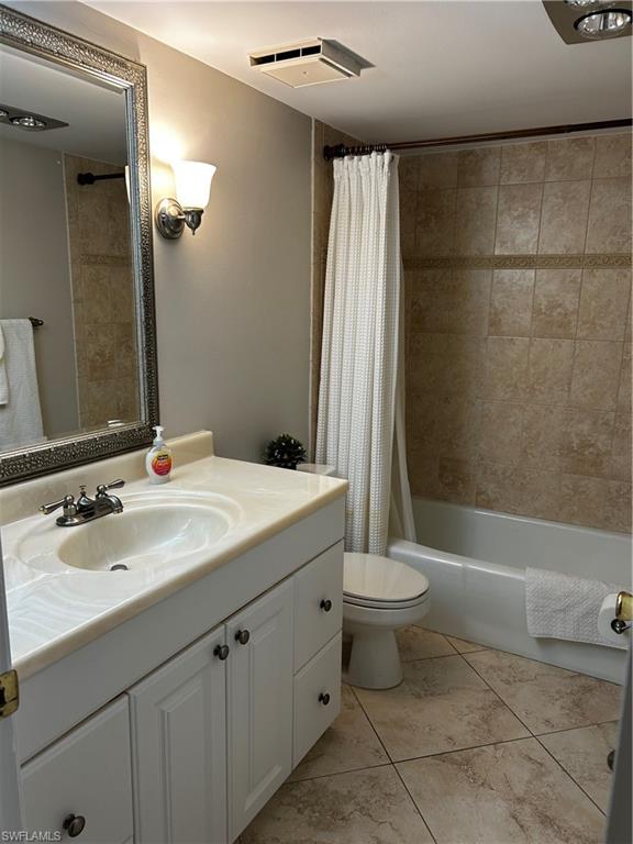 208 Bobolink Way, Unit 208B Naples, FL 34105 - Photo 12 of 20 a bathroom with a sink a toilet and shower