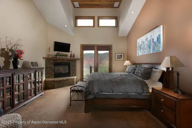 a bed room with a bed and a television