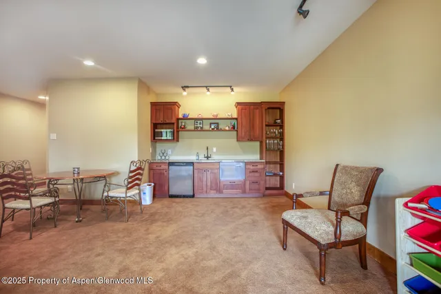 a spacious bathroom with a granite countertop sink a mirror a vanity and a bathtub