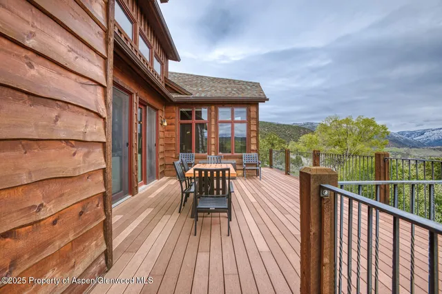 a view of balcony with wooden floor