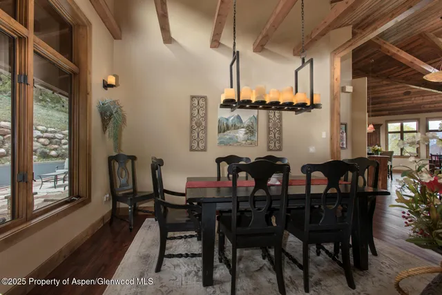 a view of a dining room with furniture and window