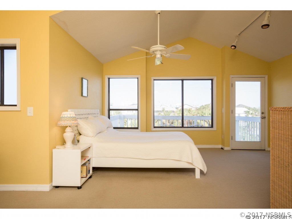 6455 Engram Road New Smyrna Beach, FL 32169 - Photo 11 of 33 a bedroom with a bed and window