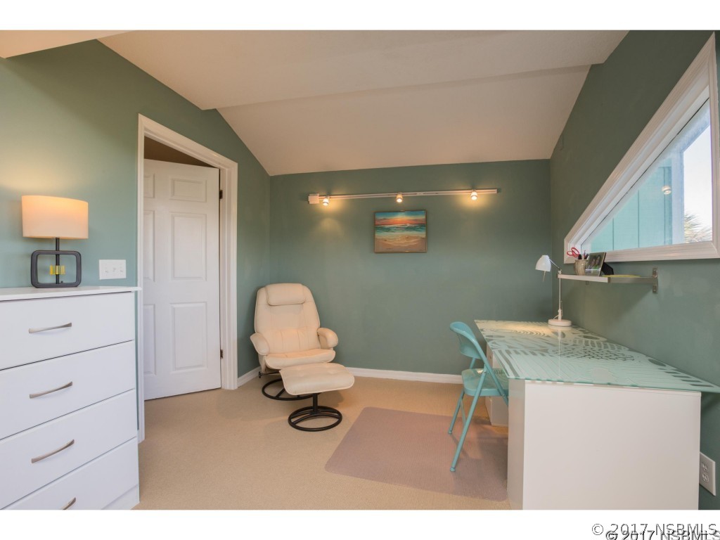 6455 Engram Road New Smyrna Beach, FL 32169 - Photo 25 of 33 a room with a chair