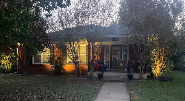 a view of a pathway of a house with a yard