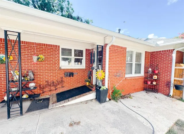 a backyard of a house with sofas