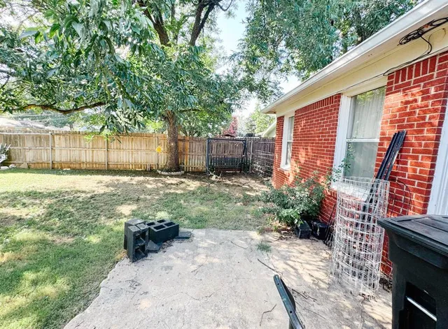 a view of a backyard with a small cabin