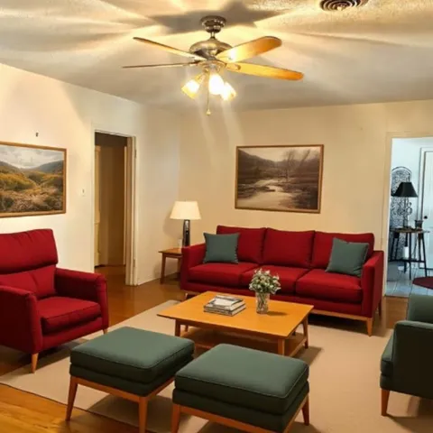 a living room with furniture a rug and a lamp