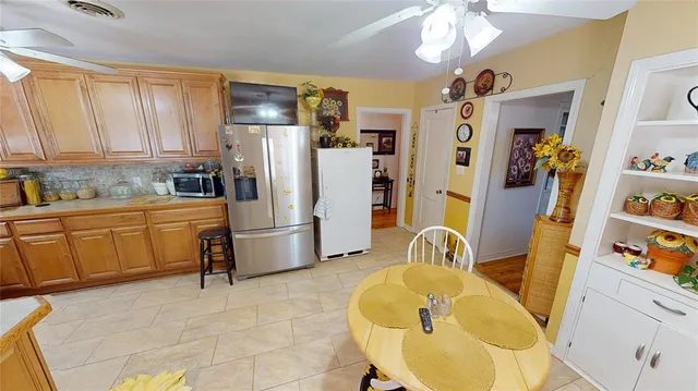 a kitchen with stainless steel appliances a refrigerator and a sink