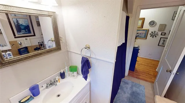 a bathroom with a sink and a mirror