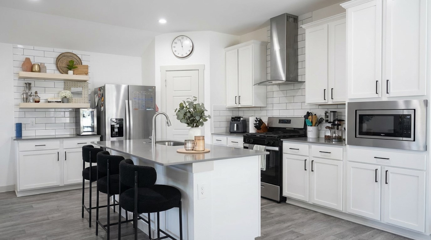 12918 Wempe Way Houston, TX 77047 - Photo 4 of 18 a kitchen with stainless steel appliances kitchen island granite countertop a sink a stove counter space and cabinets