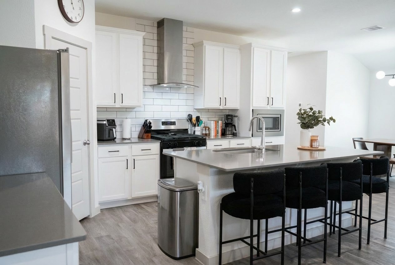 12918 Wempe Way Houston, TX 77047 - Photo 5 of 18 a kitchen with a sink cabinets and refrigerator