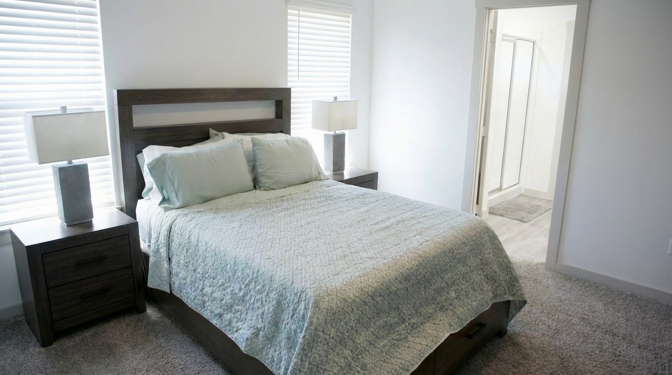 12918 Wempe Way Houston, TX 77047 - Photo 10 of 18 a large bed sitting in a bedroom next to a window