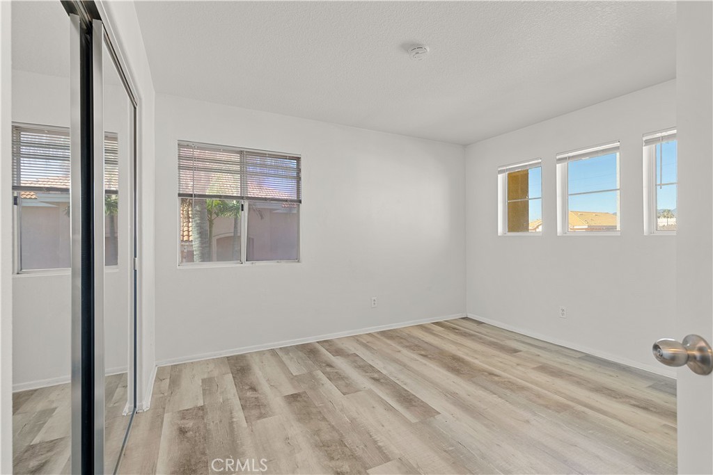 2136 East Colunga Street Colton, CA 92324 - Photo 29 of 40 a view of empty room with wooden floor and fan