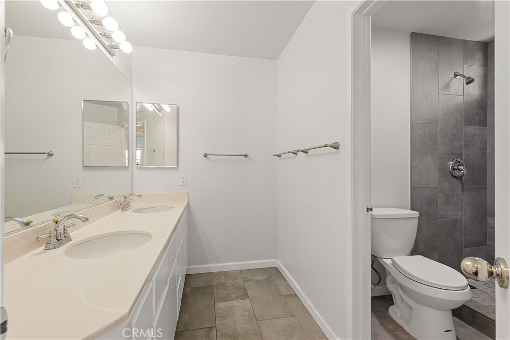 2136 East Colunga Street Colton, CA 92324 - Photo 30 of 40 a bathroom with a sink toilet and shower