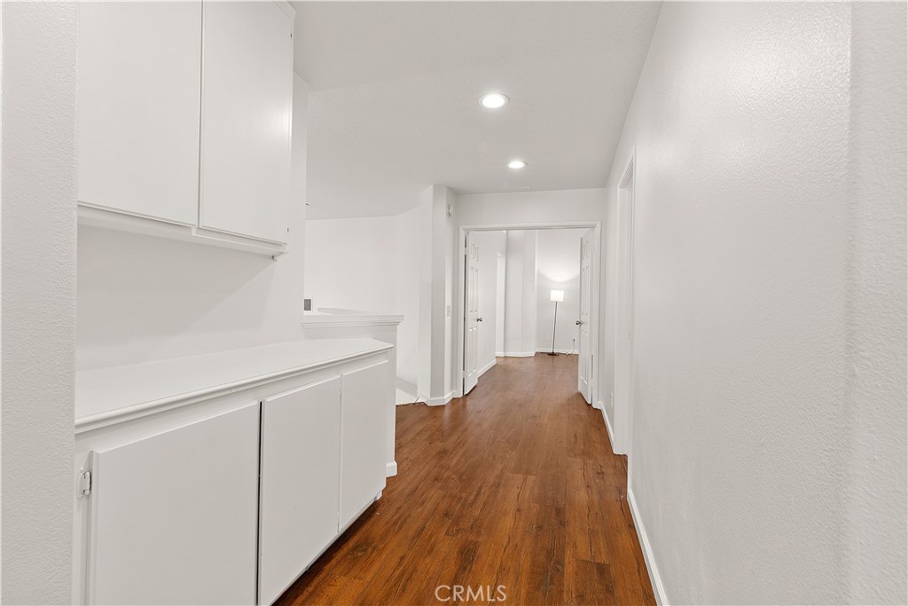 2136 East Colunga Street Colton, CA 92324 - Photo 34 of 40 a view of a hallway with wooden floor